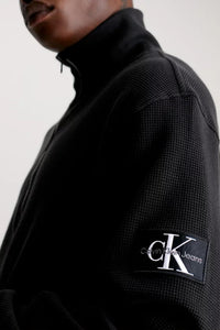 BADGE WAFFLE HALF ZIP